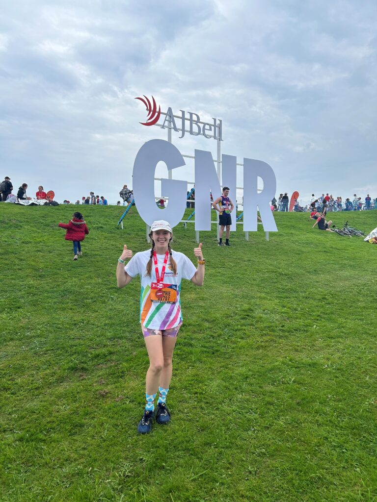 Sophie standing with her medal after completing the Great North Run.