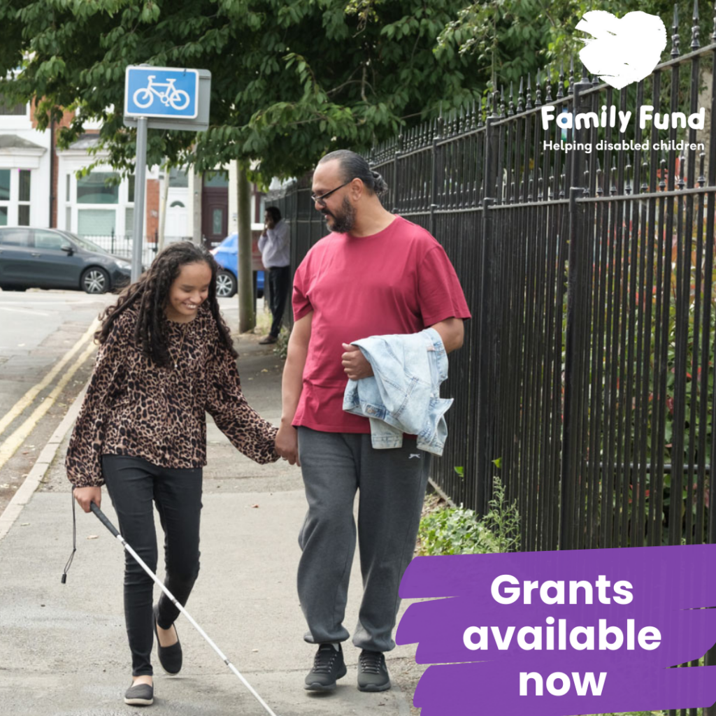 A blind girl and her dad walking in the street with a cane. The Family Fund logo is at the top right of the photo.  A text reads 'Apply now'