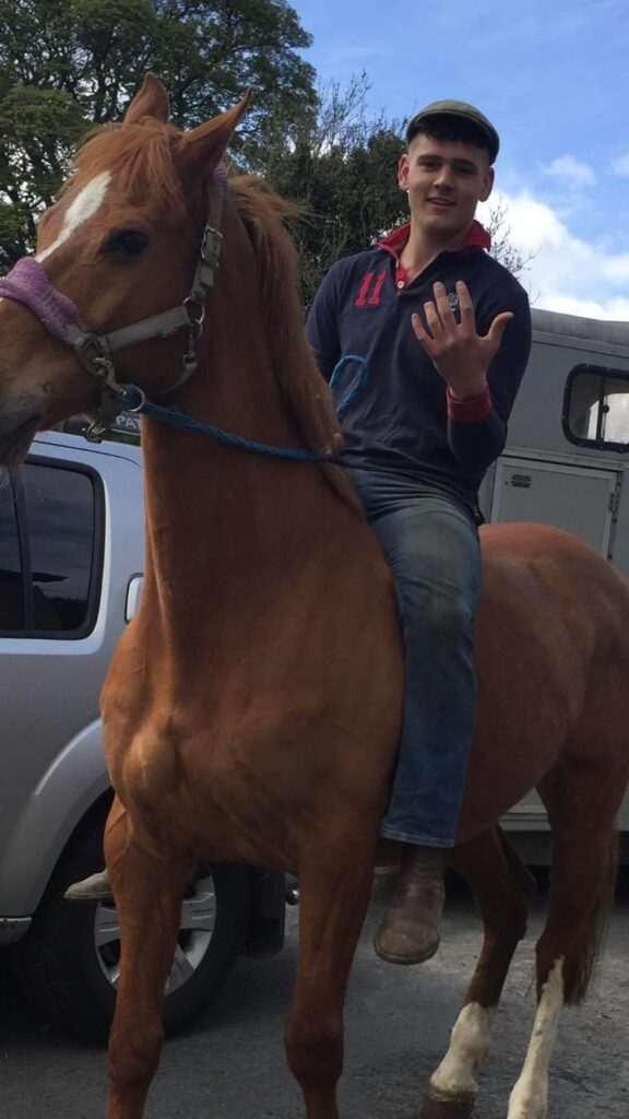 Leory, a young man, rides a large chestnut coloured horse