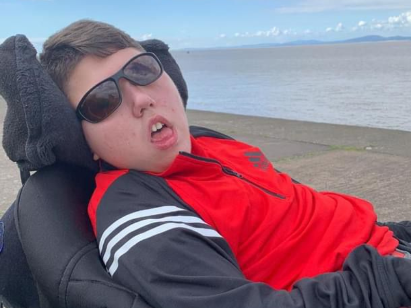 Ryan, a teenage boy, at the beach