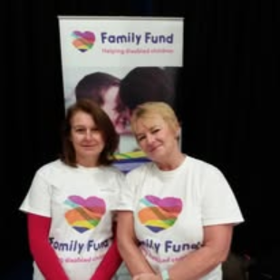 Another Family Fund event scene showing branded tables and materials arranged for visitors.