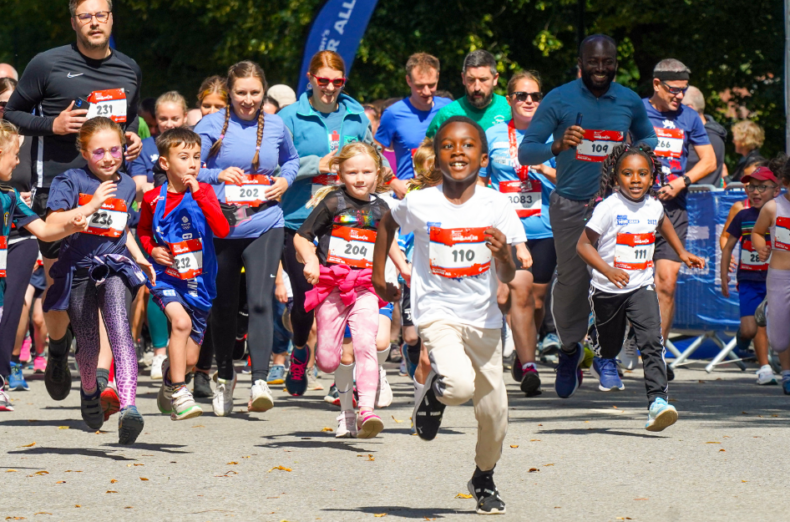 A group of children and adults participate in the York Mini race.