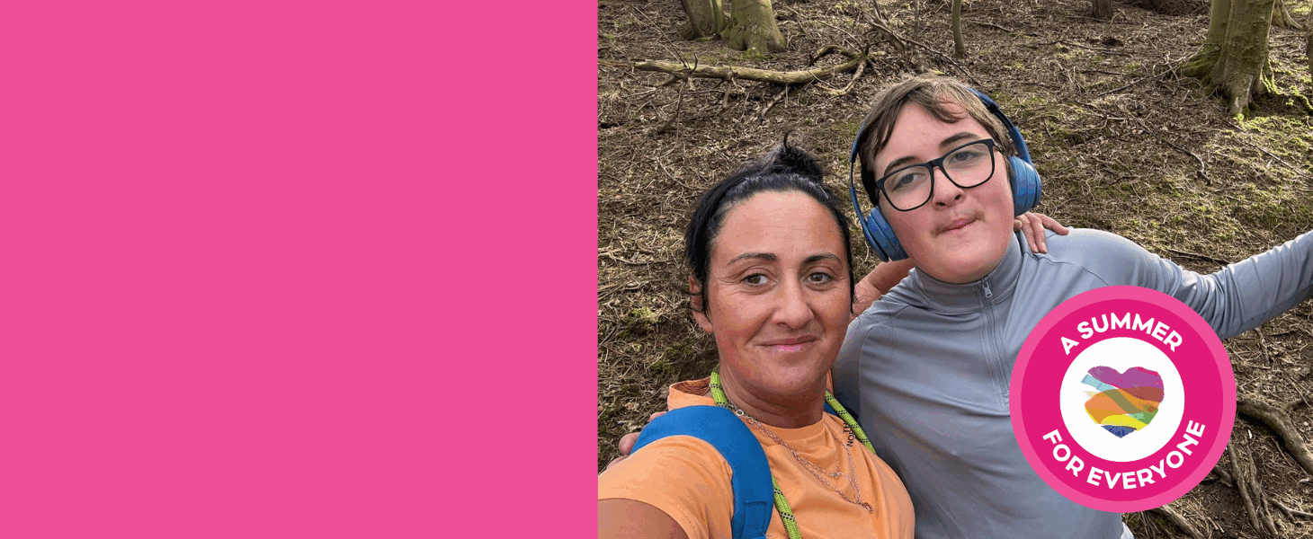 A young boy and his mum standing together in the woods. A pink circular stamp is in the corner, with a heart in the middle and text that says 'A summer for all.'