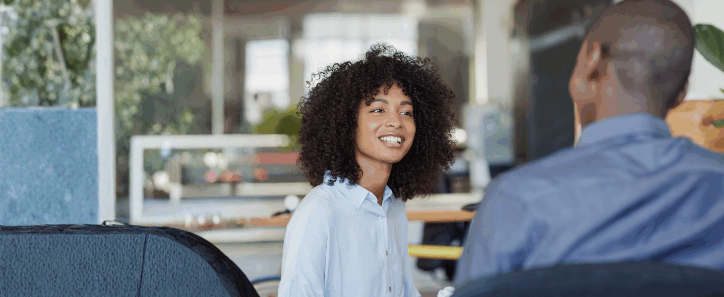 two people talking in an open space