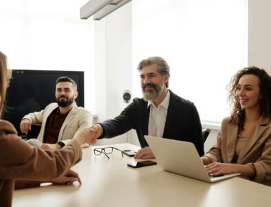 board members shake hands