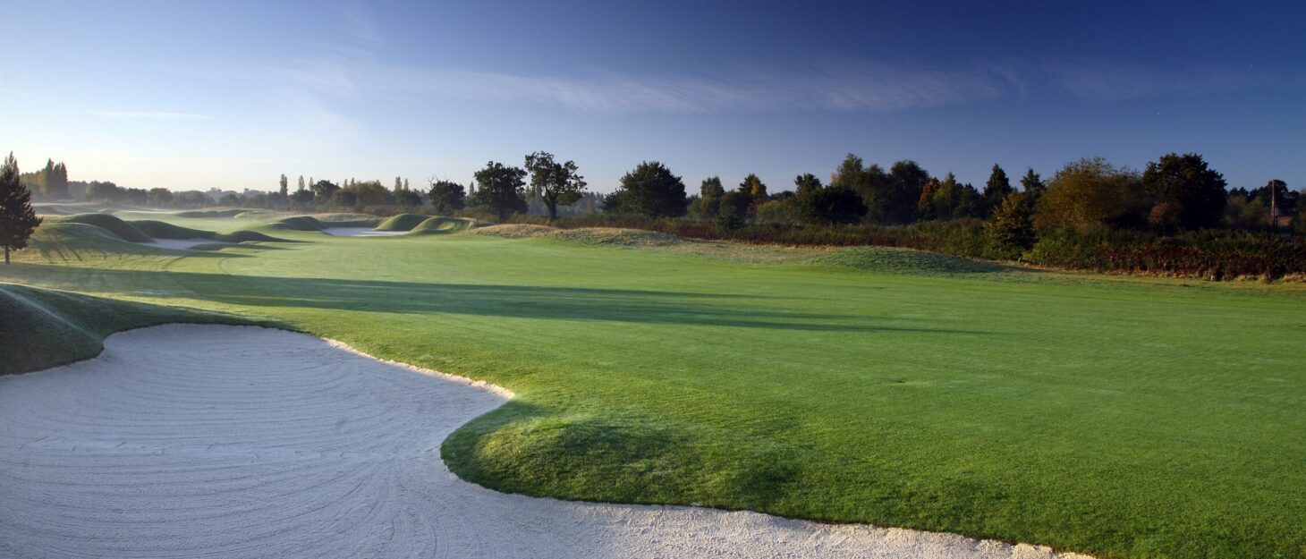 A landscaped photo of a fairway and sand bunkers on one of the PGA National holes at The Belfry.
