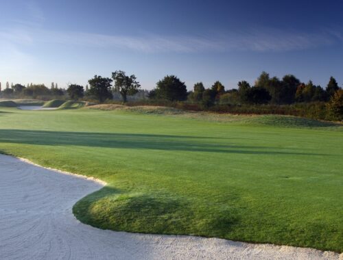 A landscaped photo of a fairway and sand bunkers on one of the PGA National holes at The Belfry.