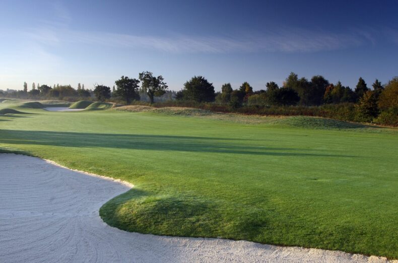 A landscaped photo of a fairway and sand bunkers on one of the PGA National holes at The Belfry.