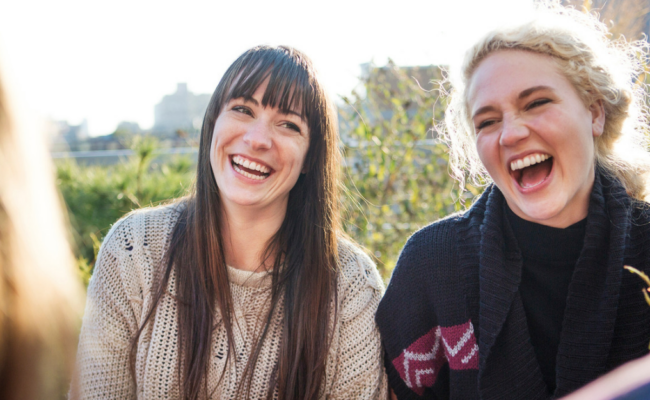 A group of friends outside laughing