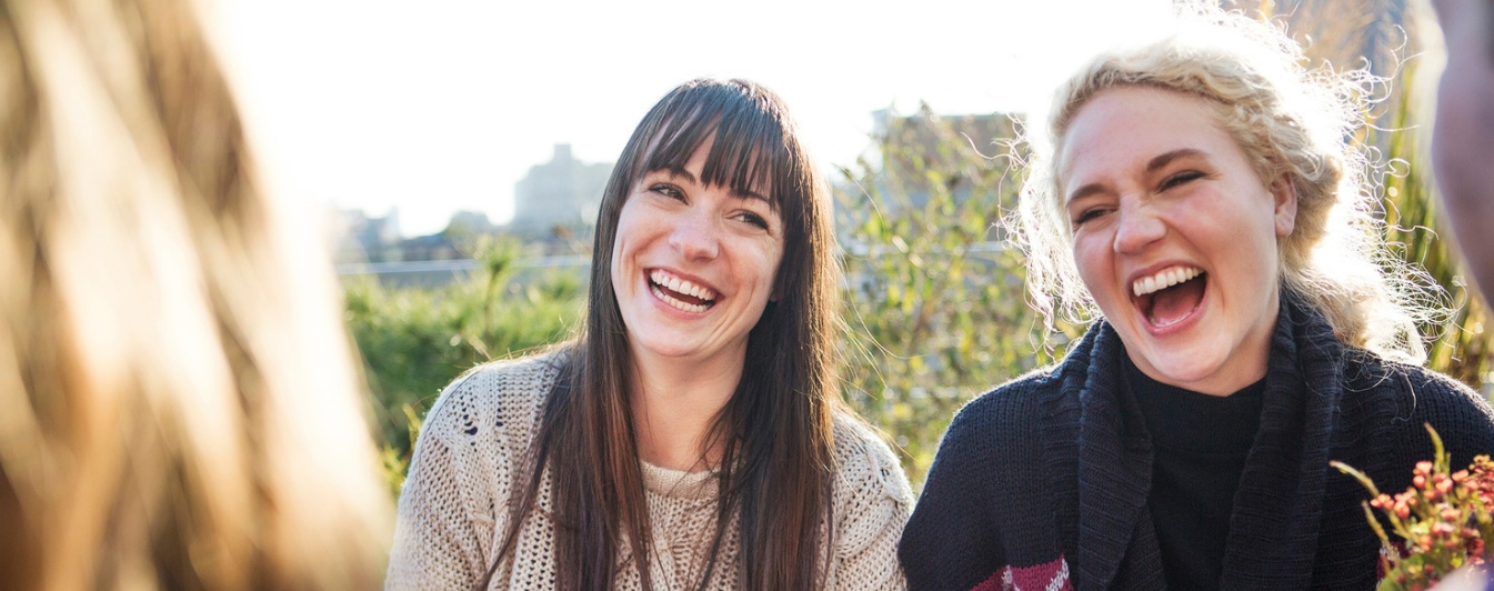 A group of friends outside laughing