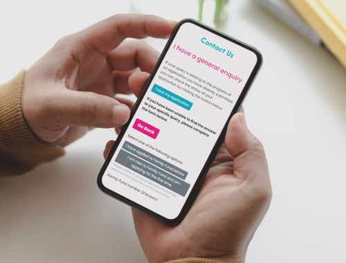Hands holding a smart phone with the Family Fund contact us online form open on the screen